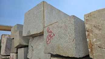 Factory workers granite slab handling production line stone manufacturing India